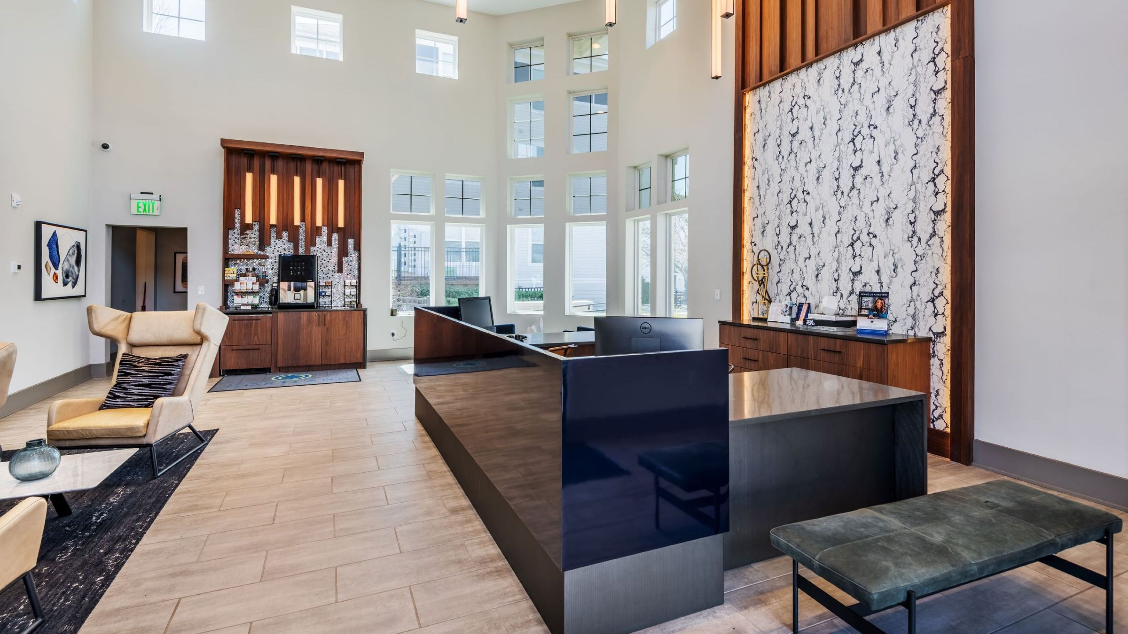 Hawthorne Davis Park resident clubhouse front lobby with a front desk, snack and coffee area, and seating
